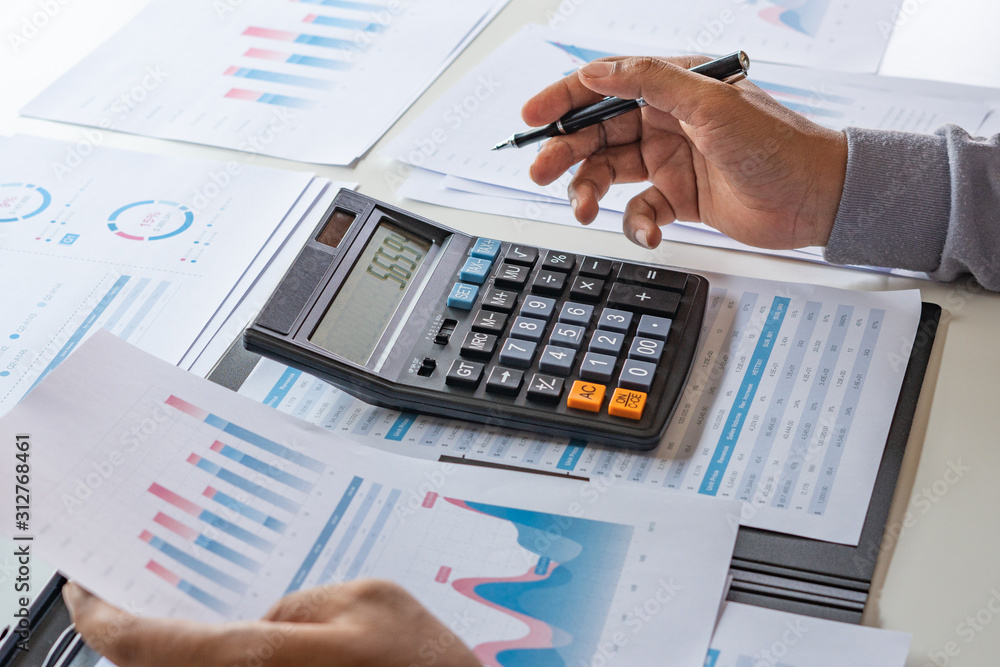 Aufkleber businessman working calculate data document graph chart report marketing research development planni