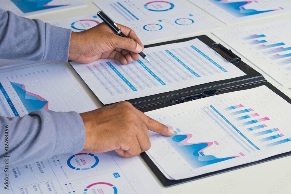 Aufkleber businessman working calculate data document graph chart report marketing research development planni