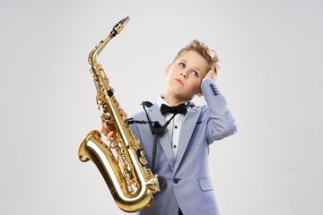 Fototapeta premium boy with saxophone