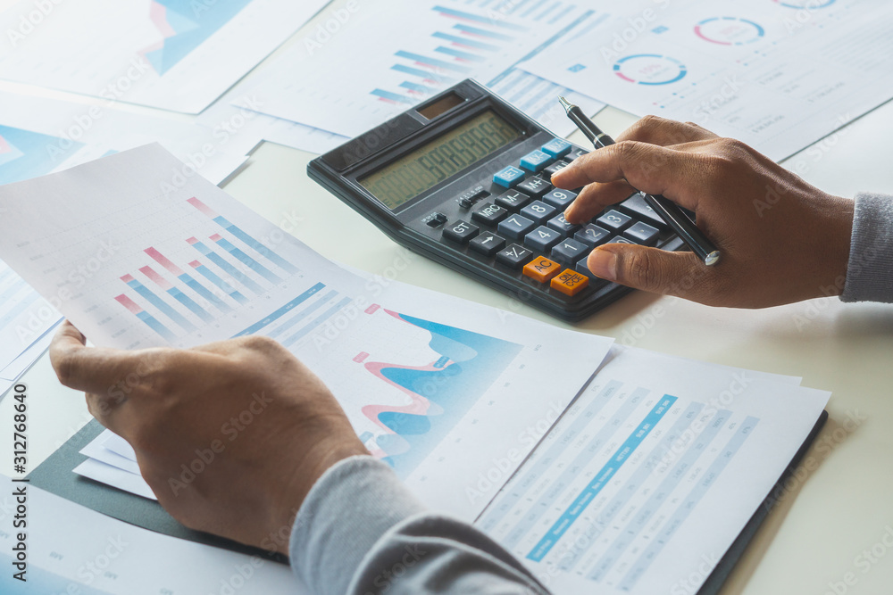 Aufkleber businessman working calculate data document graph chart report marketing research development planni