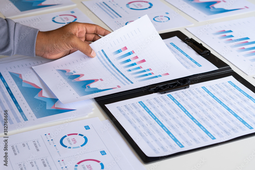 Aufkleber businessman working calculate data document graph chart report marketing research development planni