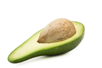Ripe organic fresh avocado isolated on white background.