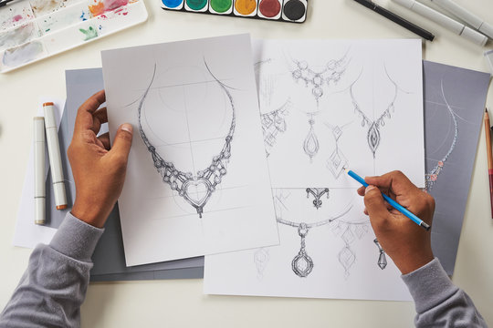 Designer design diamond jewelry drawing sketches making works craft unique handmade luxury necklaces product ideas.