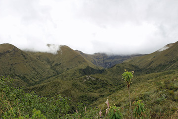 Fototapeta na wymiar Cloud-covered mountains in Ecuador near crater lake cuicocha