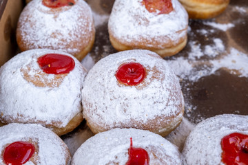 Fresh tasty donuts with jam for Hanukkah celebration sold at the local farmers market