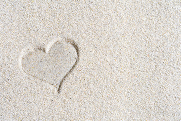 Drawn Valentines heart on the sand at the beach. Concept