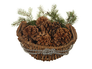 Decorative basket with fir cones and branches isolated on a white background.