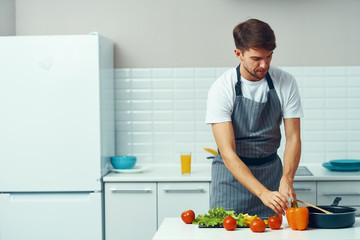 man preparing food in kitchen