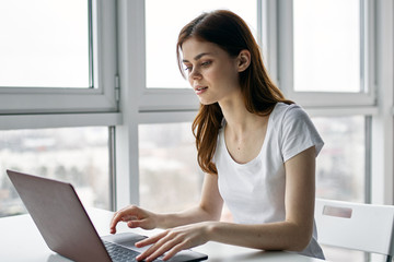 woman working on laptop at home