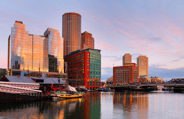 Obraz premium Boston Harbor at sunrise viewing from Fan Pier Park. Boston Harbor is a natural harbor and estuary of Massachusetts Bay,