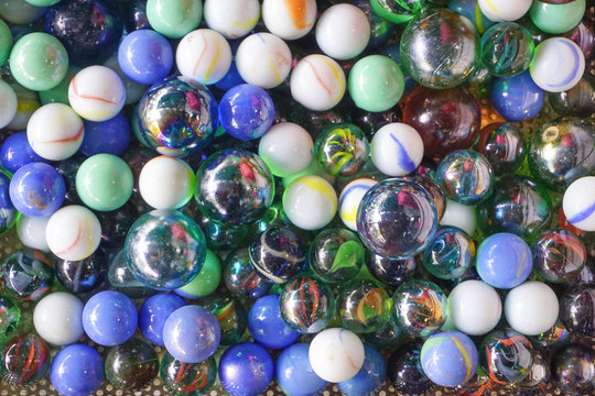 Group colorful glass marbles ball different color for decorate garden or fish aquarium,multi color abstract background,transparent circle shape crystal ball rainbow