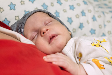 sleeping happy newborn babe close up, selective focus