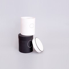 Black and white boxes of a gift isolated on a grey background