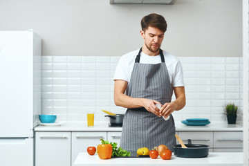 man preparing food in kitchen