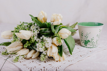 Bouquet of white tulips with lilac