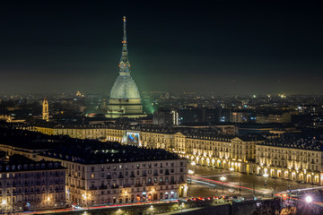 Scenic night cityscape of Turin with the Mole Antonelliana and Vittorio square lighted for the new year celebrations. Italy