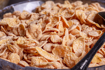 Corn flakes, served with milk and yogurt