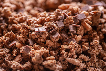 Obraz premium Muesli chocolate with pieces of chocolate and nuts