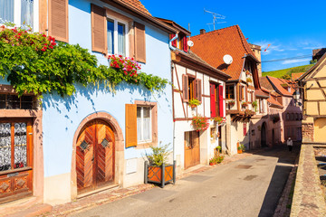 Street with beautiful houses in Hunawihr village which is located on famous Alsace wine route, France