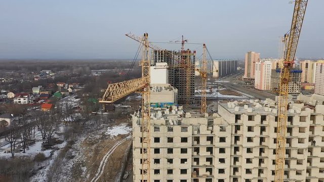 Construction site with a bird's eye. Flying over the construction site. The construction of the plant in the city.