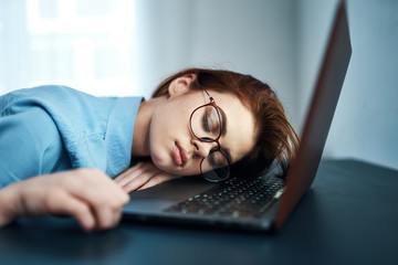 man sleeping on laptop