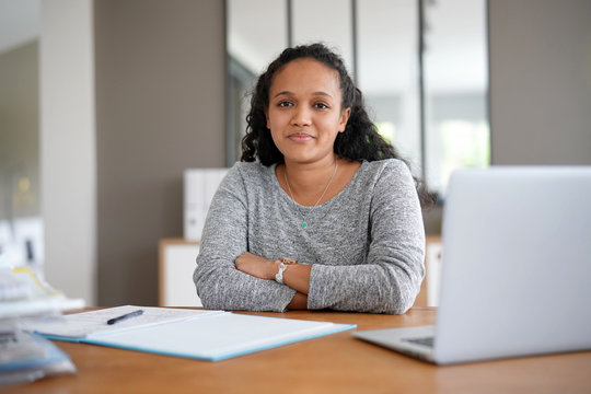 metis woman working in office