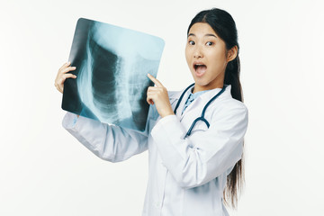 female doctor looking at xray