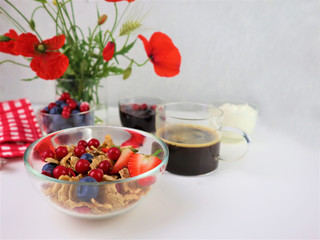 Breakfast served with coffee, cereals and fruits.