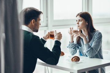 couple having breakfast in the kitchen