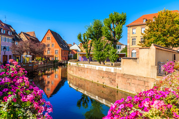 Flowers on canal bridge in Colmar village, Little Venice, Alsace Wine Route, France