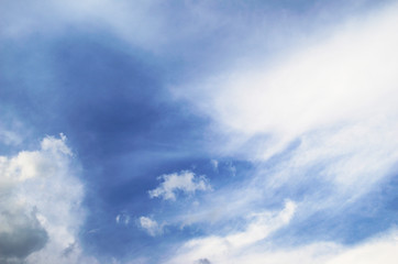 Blue sky and fluffy clouds. Beautiful cloudscape background. Sunlight on the clouds.