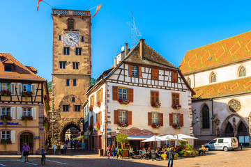 ALSACE WINE REGION, FRANCE - SEP 20, 2019: Restaurants and colorful houses on main square of Ribeauville village which is located on Alsatian Wine Route, France.