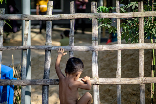 Rohingya Refugee Children Playing On The Fence Of Refugee Camp In Teknaf Bangladesh