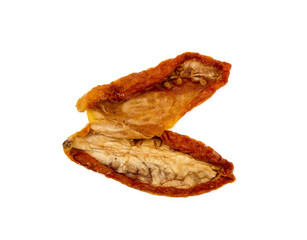 Dried red tomatoes isolated on white background