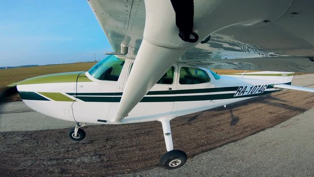 Side view of a small plane starting to take off