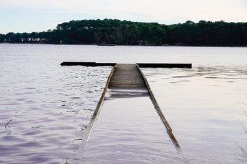 Wooden submerged pontoon jetty sunken in lake Maubuisson Carcans France