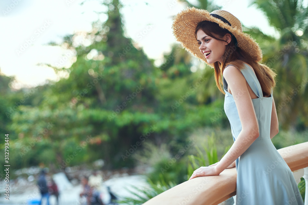 Wall mural beautiful woman green leaves nature