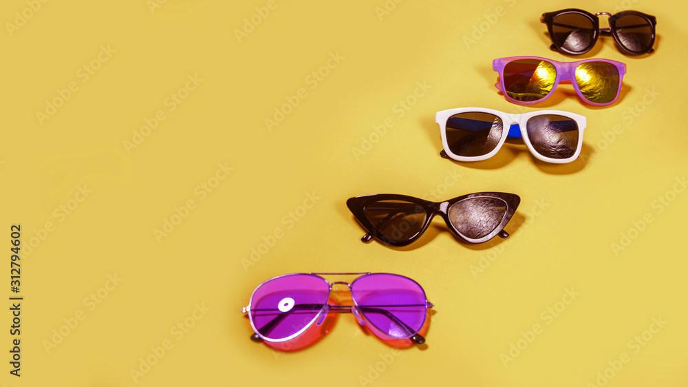 Poster variety of sunglasses over colorful background