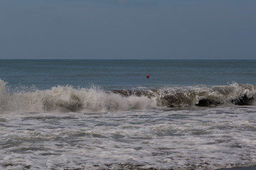 Georgia. Embankment near the railway station. Waves, sea, sun