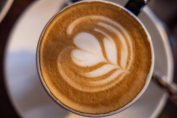 Cappuccino and Coffee with Latte Art and Thick Cream and Sugar On A Wooden Table In South Africa 