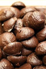 Selective focus. Marshmallows in chocolate as a background.