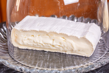 Piece of cheese in glass vase