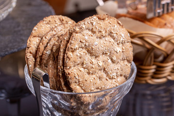 Oatmeal bread with oatmeal and nuts in glass vase
