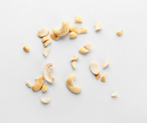 Tasty cashew nuts on white background