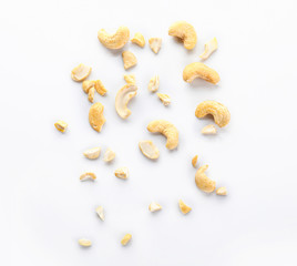 Tasty cashew nuts on white background