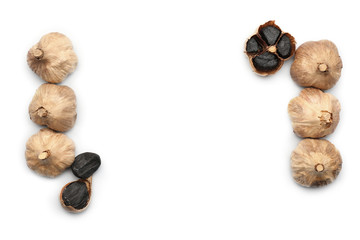 Black garlic on white background