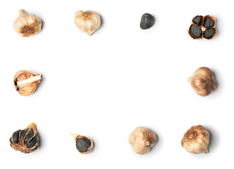 Frame made of black garlic on white background