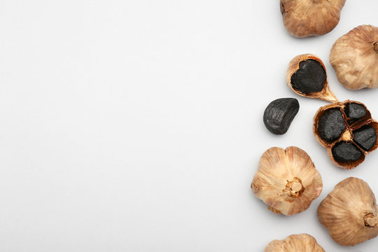 Black garlic on white background