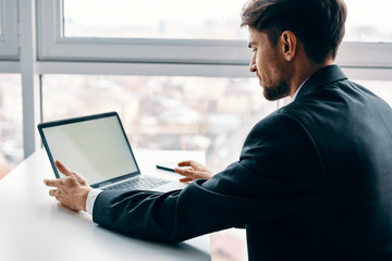 man working on laptop at home