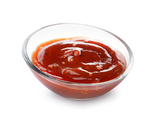Bowl with tasty barbecue sauce on white background